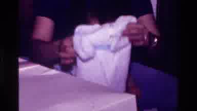 California USA (1977): toddler girl gets a white formal church dress