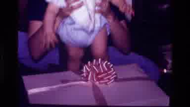 California USA (1977): Adult And Baby Opening Presents Together Very Cute
