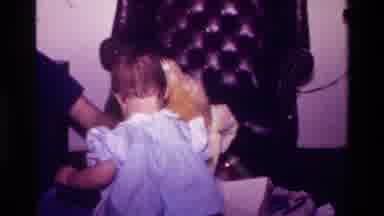 California USA (1977): A Little Baby Girl Playing With Her New Toys
