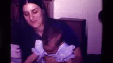 California USA (1977): Toddler Playing With And Carrying Large Teddy Bear Around