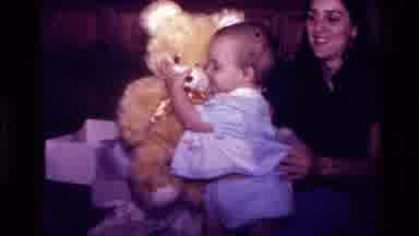 California USA (1977): Playful And Happy Baby Gets Multiple Fluffy Puffy Christmas