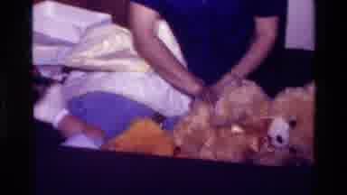 California USA (1977): A Parent Plays With Their Baby
