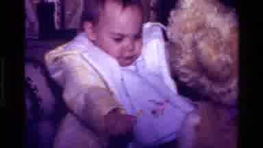 California USA (1977): A Small Cute Baby With A New Brown Teddy Bear