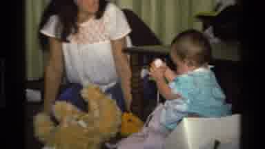 California USA (1977): Baby Discovers Gifts In A Box And Shares The Essence With