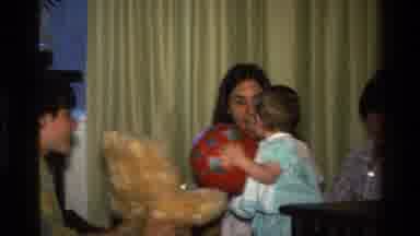 California USA (1977): A Baby Girl Interacting With Her Toys And Her Mom