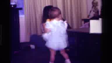 California USA (1977): Baby With Teddy Bear In Front Of Woman