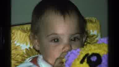 California USA (1977): A Cute Baby Boy Behind The Blanket
