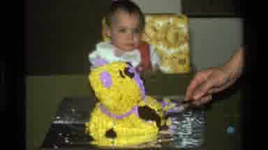 California USA (1977): Someone Is Cutting The Cake And Baby Is Messily Eating Cake