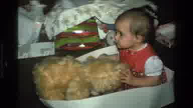California USA (1977): Baby Girl Playing With Golden Teddy Bear