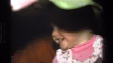 California USA (1977): Baby Laughing Stumbling And Holding Her Bottle