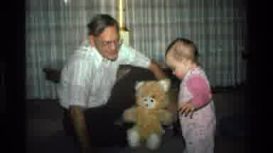 California USA (1977): Father Watching His Daughter Walk Near A Stuffed Animal