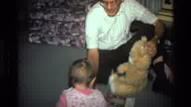 California USA (1977): A Little Kid Is Entertained By Its Grandfather In The House
