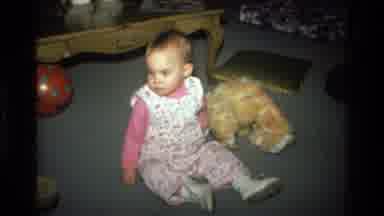 California USA (1977): A Baby Girl Attempting To Learn How To Crawl