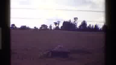 KENYA-1983: Small Hut In Open Field Near Trees And A Waterfall