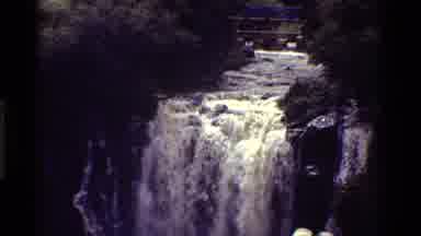 Kenya (1983): Vintage Lush Waterfall With Tourists Watching As Camera Zooms Out