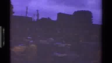 Kenya (1983): People Walking Around Busy Marketplace At Dusk Large Building In