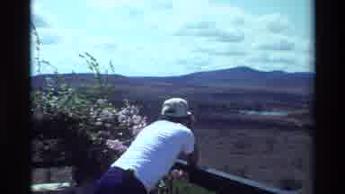 Kilaguni Kenya (1983): A Man Standing On A Balcony Looks Out Over The Savannah At