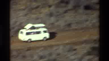 Kilaguni Kenya (1983): Aerial Shot Of Camper Van Heading Down A Dirt Path Into