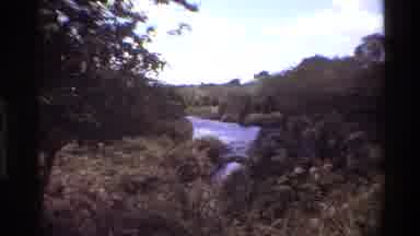 Kilaguni Kenya (1983): River Inside Forest Windy Day Cloudy Sky Water And Tree