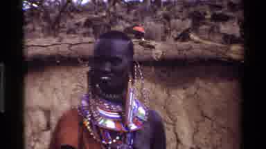 Kilaguni Kenya (1983): Man In Traditional Garb Near Rustic Houses
