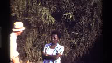 Mara Tanzania (1983): People Looking At Wood Items On Display At Outdoor Market