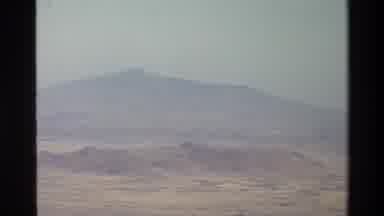 Mara Tanzania (1983): Footage Of A Mountainous Background And People Getting Off A