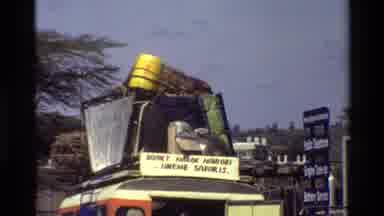 Mara Tanzania (1983): Video Shot Of Indian Gas Station Looking At The Cars And