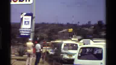 Mara Tanzania (1983): A Number Of White Vans With Blue And Green Horizontal Stripe