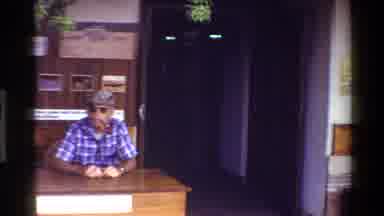 Mara Tanzania (1983): A Man Sitting At A Desk Outside With Followed By A Scene Of