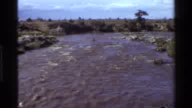 Mara Tanzania (1983): Steams Beds Moving Water Cloudy Skies Foliage