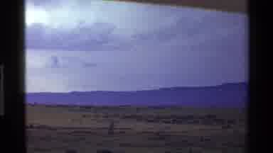 Mara Tanzania (1983): Green Barren Field Covered With Clouds Feel Like Its About
