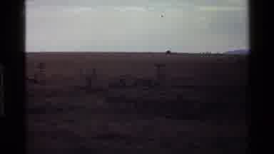 Mara Tanzania (1983): Abandoned Desert Land With Mountains Framing The Background