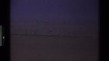Mara Tanzania (1983): A Male Lion Sitting Alone In Grasslands In The Late Evening