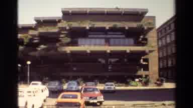 Nairobi Kenya (1983): Panoramic Of Two Buildings With Several Cars Parked In Front