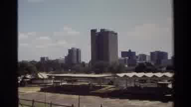 Nairobi Kenya (1983): Shelters With No Sides Stand In Front Of A Body Of Water