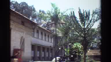 Nairobi Kenya (1983): Travel Shot Of Temple With Palm Trees With Opening Shot Of