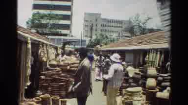 Nairobi Kenya (1983): People Walking Through A Market-Like Pathway With Merchants
