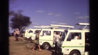 Nairobi Kenya (1983): Bushes And Trees Tourists Getting Into White Tour Vans/Small
