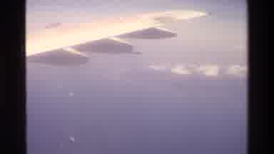 Singapore (1984): Airplane Clouds Water Peninsula Earth Land Ocean Sky Fly White