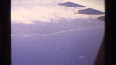 Singapore (1984): A Small Beach And An Island Area Filmed Far Away From A Plane