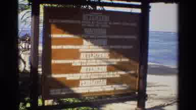 Singapore (1984): Viewing A Foreign Directory In A Brief Moment On The Beach