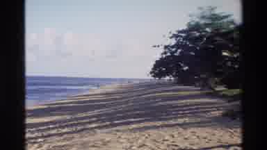 Singapore (1984): A View Of A Sandy Ocean Beach With A Brief View Of An