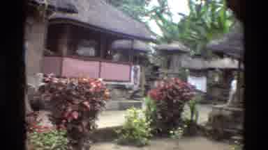 Singapore (1984): Thatched Roofed Houses With Steps Red Bushes Palm Trees Man In