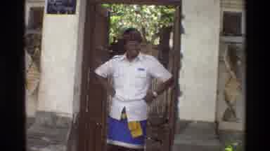 Singapore (1984): Elated Asian Man Standing Overseeing Front Courtyard Including