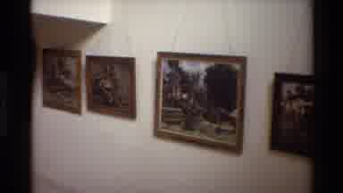Singapore (1984): A Few Paintings Hanging On A Wall And A Woman Walking With