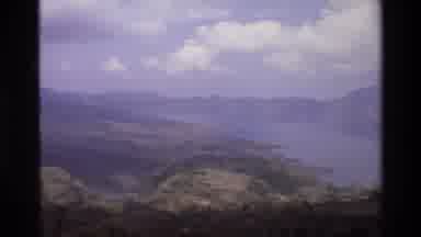 Singapore (1984): Landscape Including Rolling Hills A Large Plain A River And A