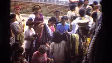 Singapore (1984): People Are Watching The Cloths Displayed By The Native People In