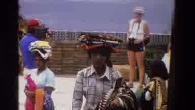 Singapore (1984): Some Tourists Are Observing The Village Made Cloths Displayed By