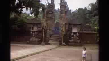 Singapore (1984): Zooming In On Gate Guarded By Two Large Rock Figures As A Small