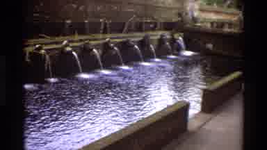 Singapore (1984): Man Walking Toward Water Fountain